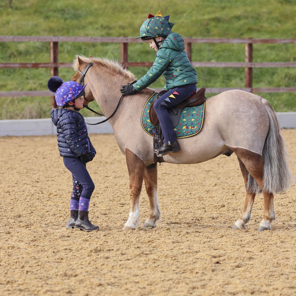 Two children wearing Tikaboo Padded Coats