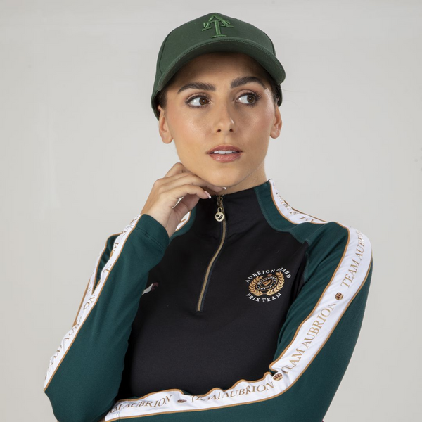 Close up of lady wearing Aubrion Team Winter Baselayer in Green