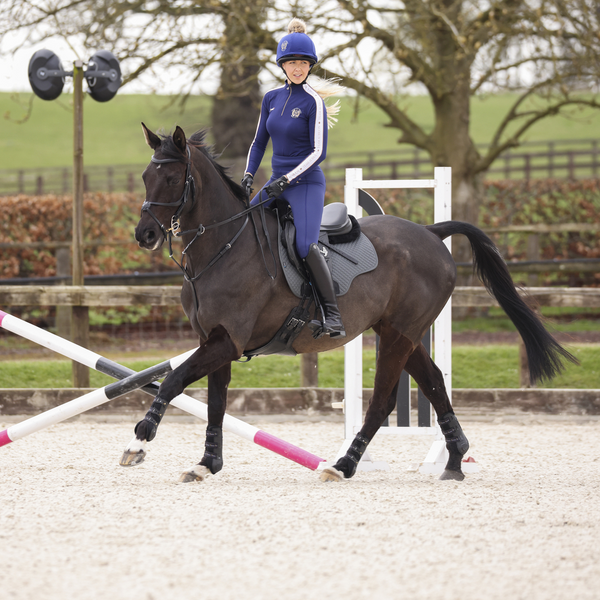 Rider wearing Aubrion Team Winter Baselayer in Navy