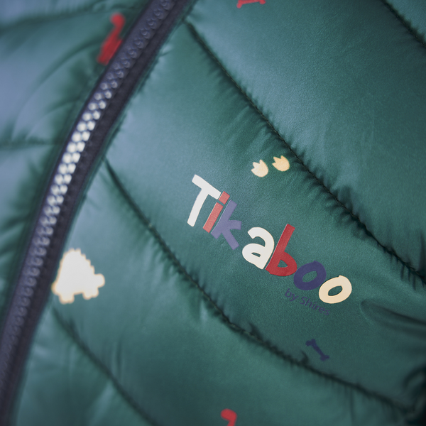 Close up of branding on Tikaboo Padded Coat in Dinosaur