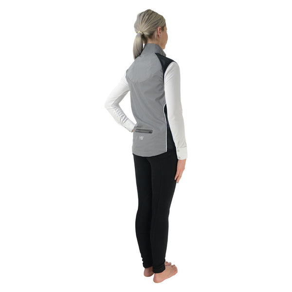 Rear view of model wearing Silva Flash Reflective Gilet by Hy Equestrian