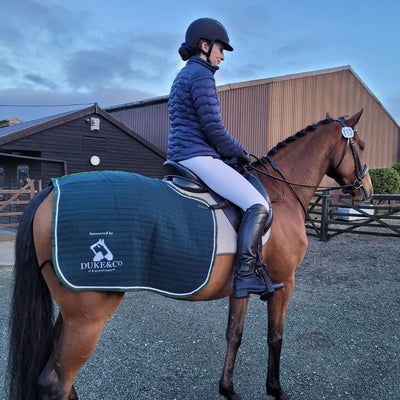 Photo of sponsored rider wearing Hy Equestrian Padded Jacket before a competition