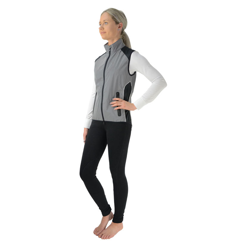 Model wearing Silva Flash Reflective Gilet by Hy Equestrian