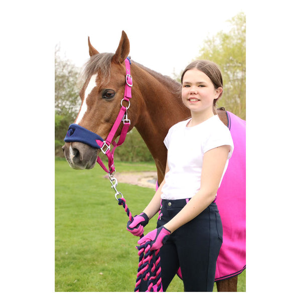 Rider wearing Hy Equestrian Belton Children’s Riding Gloves in pink